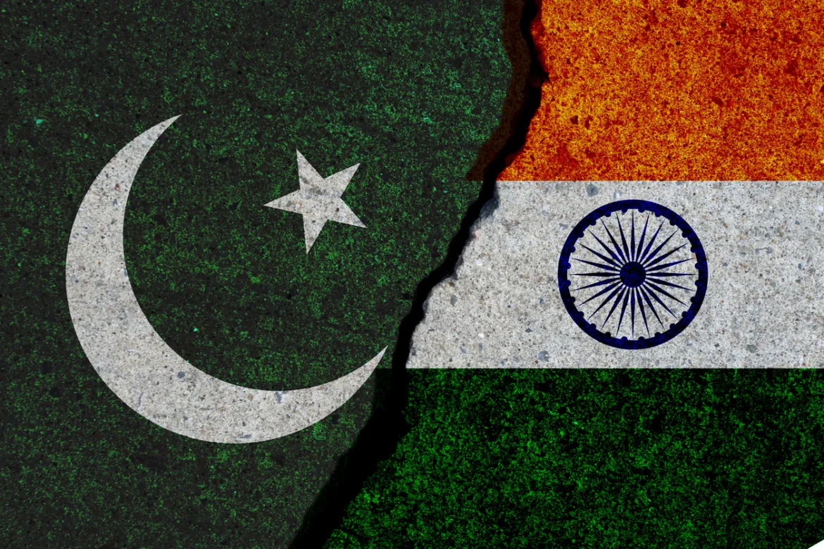 pakistan and india flags painted over cracked concrete wall